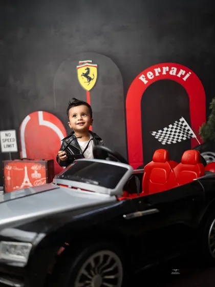 Looking up with a sweet expression, this little racer takes a break from driving. I aim to capture a mix of posed and natural shots in every session.