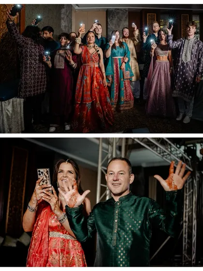 Lights, music, and love. This shot captures the guests creating a magical atmosphere with their phone lights, a beautiful, interactive moment during the Sangeet night.
