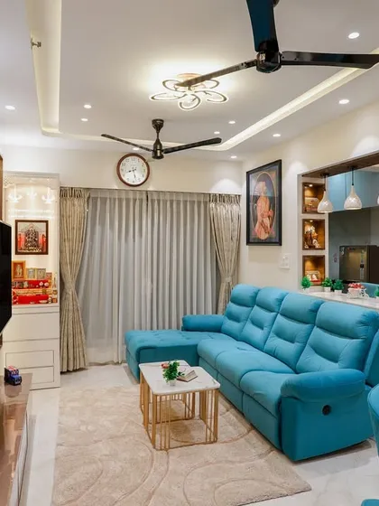 This shot highlights the open-concept layout, connecting the living room, breakfast counter, and dining area.