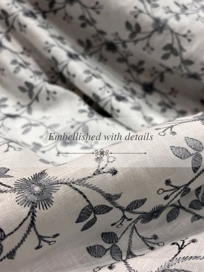 This beautiful grey-on-white floral embroidered linen is a perfect example of our commitment to detailed and artistic textiles.