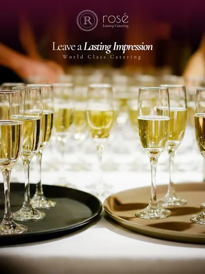 Rows of champagne flutes ready for a toast. We are committed to leaving a lasting impression through flawless service, ensuring every detail of your celebration is handled with care.