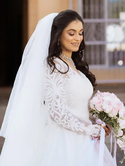 A close-up of the bride's soft and pretty makeup for her Catholic wedding.