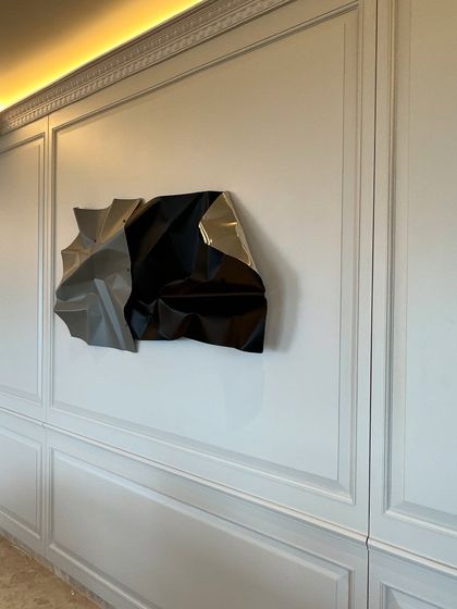 The clean, elegant lines of the room are the perfect backdrop for the sculpture's complex form.