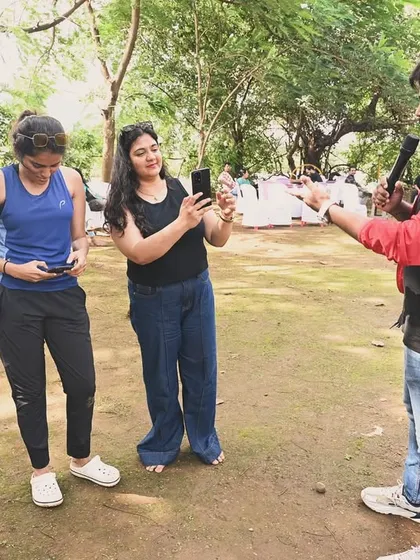 Reviewing a fun photo or video with participants during a break in the games. My interactive style ensures I am always connected with the crowd, making adjustments to keep the energy up.
