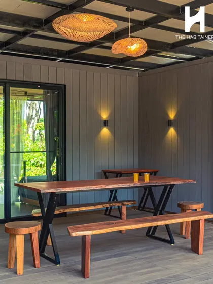 We create inviting communal areas that enhance the guest experience. This rustic-chic outdoor dining space is part of a multi-unit container project in Coorg, designed for guests to gather and enjoy the serene surroundings.