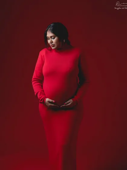 A full-length view of the stunning red-on-red portrait. This look is incredibly powerful and makes a bold, confident statement.
