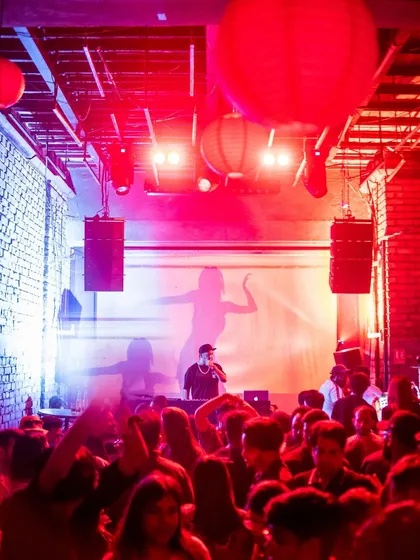 A view from the back of the club, showing me on stage commanding the crowd.