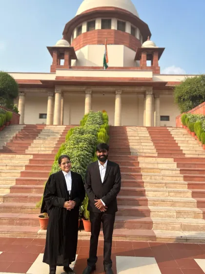 With a colleague outside the Supreme Court. Building a strong professional network is key in the legal field.