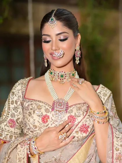A serene moment with eyes closed, this shot highlights the beautiful, soft blending of the eyeshadow and the radiant glow of her skin.