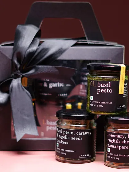 Thoughtful gifting, made easy. Our elegantly packaged snack box hamper, featuring a selection of our favorite artisanal jars like basil pesto and savory crackers, is the perfect gift for festive occasions like Rakhi or Diwali.