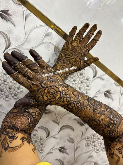 A dynamic pose showing how the intricate design wraps around the hands and arms, creating a beautiful flow of patterns.