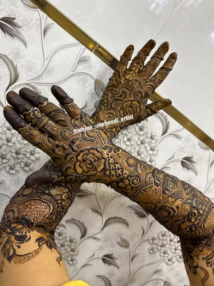 A dynamic pose showing how the intricate design wraps around the hands and arms, creating a beautiful flow of patterns.