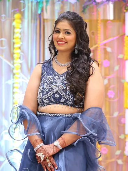 Posing for the camera, this client looks confident and beautiful. Her soft glam makeup is perfect for the bright lights of a wedding reception.