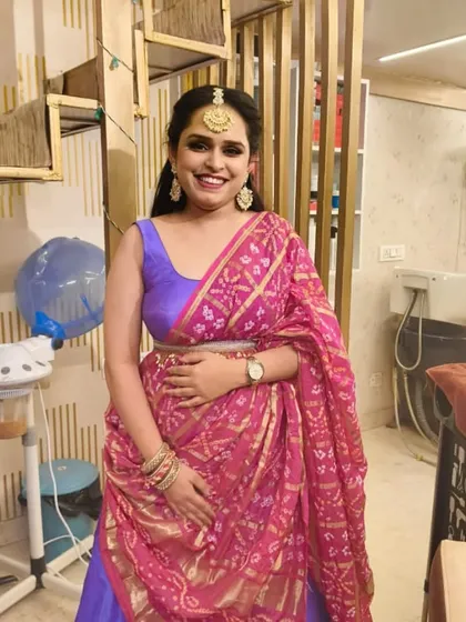 A full-length view of a client ready for a party. Her traditional attire is complemented by our professional makeup and hairstyling, showcasing a complete and polished look from head to toe.