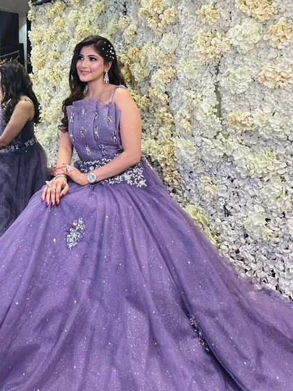 A closer look at our client in the lavender gown. The intricate silver embroidery on the bodice adds a touch of glamour, while the soft tulle skirt keeps the look romantic and ethereal.