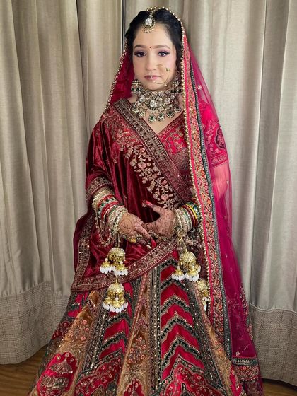 The full bridal look. The magnificent lehenga, the heavy jewelry, and the beautiful makeup all come together to create a breathtaking vision.