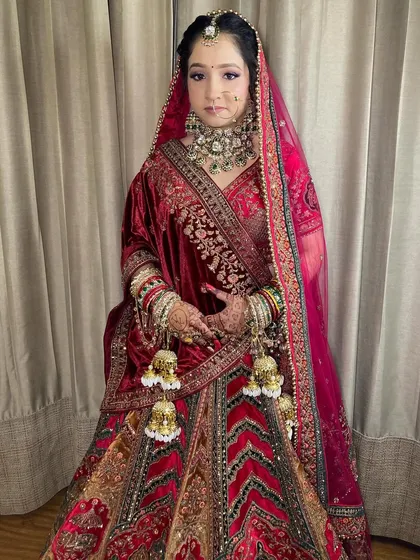 My bride Komal, looking absolutely radiant. I used soft purple and pink tones on her eyes to complement her beautiful velvet lehenga.