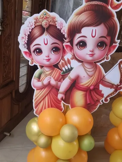 Detailed view of the cute Ram and Sita character cutouts, perfect for adding a special touch to a religious or traditional celebration.