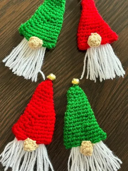 These cute gnome brooches, in festive red and green with fluffy white beards, are a quirky and fun accessory for the Christmas season.