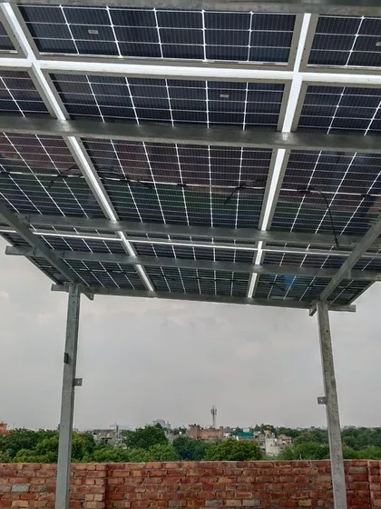A look from underneath the solar panel array. The sturdy galvanized iron structure is engineered for long term stability and can withstand various weather conditions, protecting your investment.