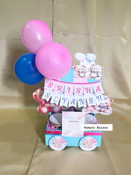 A full view of the teddy-themed twin hamper, a perfect way to thank guests for celebrating two little blessings.