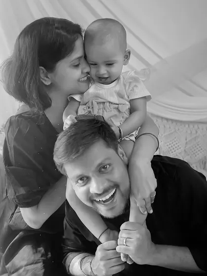 A black and white version of a joyful family moment, adding a classic and timeless feel to this playful piggyback ride.
