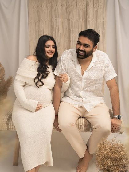 Laughter and love. This candid moment captures the joy and easy connection between the expecting couple. My sessions are relaxed, so your true personalities can shine.