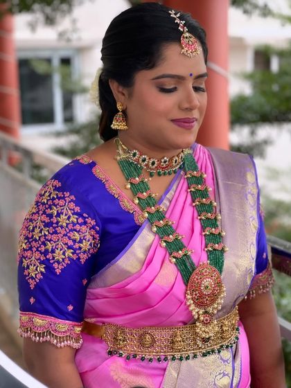 A close-up showcasing the beautiful, glowing makeup and the intricate details of her traditional South Indian jewelry.
