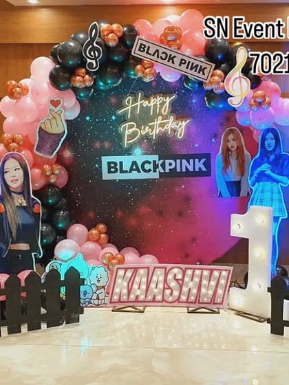 Is your daughter a Blink? I can create a K-Pop inspired Blackpink theme party. This setup includes a galaxy backdrop, cutouts of the band members, and themed props for a 10th birthday celebration.