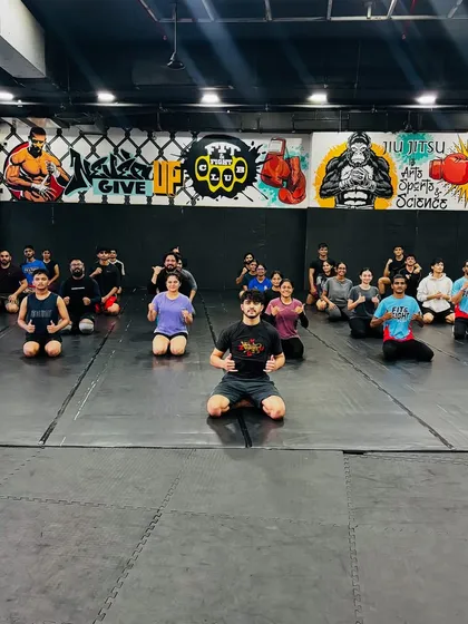 A moment of respect and learning. Our members pose with Coach Yaqoub Doty after an intense and insightful BJJ session. Oss!