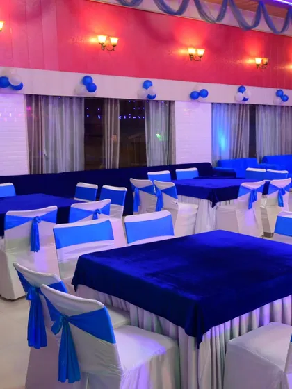 Another view of the blue and white themed seating arrangement. This look is great for corporate events, birthdays, or any party with a specific color scheme.