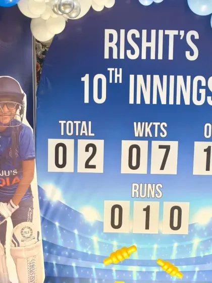A close-up of the custom scoreboard backdrop, personalized with the birthday boy's name and age, making it his "10th Innings."