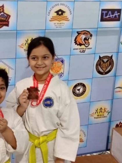 Two of our youngest medalists from the Delhi State Championship, proudly showing their awards.