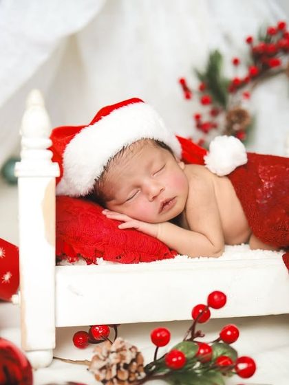 Christmas is here! A sleeping newborn in a tiny bed, dreaming of sugarplums. So peaceful and festive.