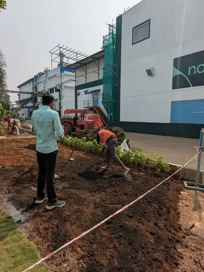 Here is a wide view of our industrial landscaping project for Novonesis. Our team is preparing a large patch of land adjacent to the existing lawn for rework and new planting.