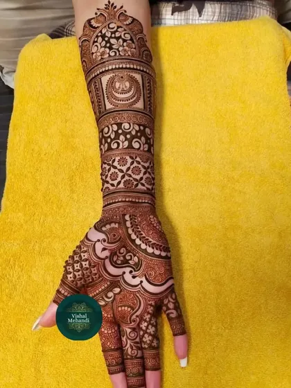 A classic design with a mix of modern and traditional elements, including a half-moon (chand) motif on the arm.