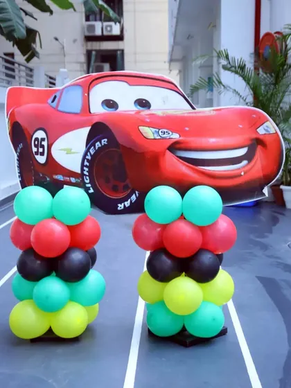 Kachow! A life-sized Lightning McQueen cutout makes for an incredible photo opportunity. I use large, impactful props like this to make the theme feel real and exciting for the kids.
