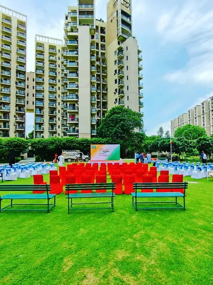This is an example of an outdoor setup for a society's Independence Day celebration. I arranged the seating in a tricolor theme facing the main stage, ensuring a clear view for all residents in a large park at Uniworld Gardens.