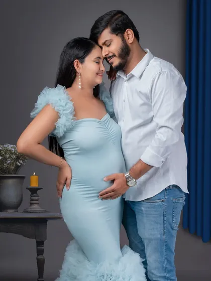 A tender moment between an expecting couple. The simplicity of the setup puts all the focus on their connection and happiness.