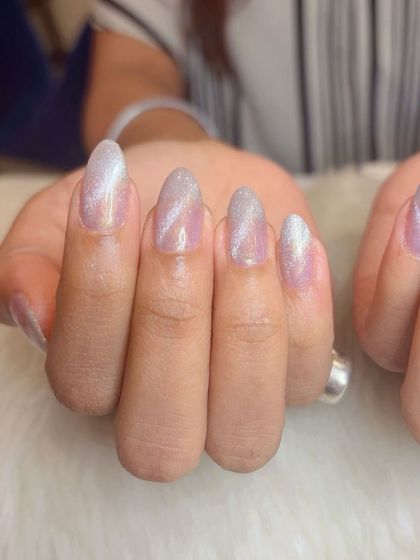 A close-up of the silver cat eye polish on natural nails.