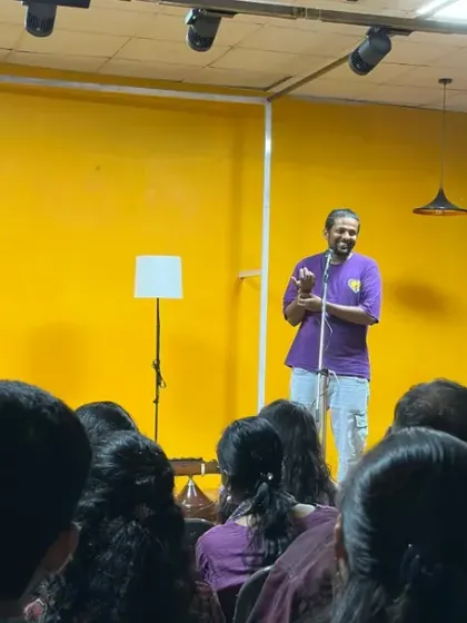 An organizer addresses a full house at Karmasthan. This photo shows our space filled with an attentive audience, highlighting its capacity to host talks, presentations, and community gatherings.