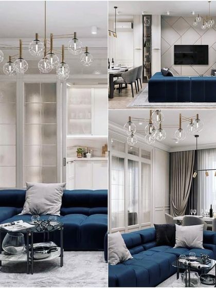 Innovation and creativity go hand in hand. This living room setup features a beautiful blue sofa, elegant glass partition, and a stunning chandelier, creating a sophisticated and modern space.
