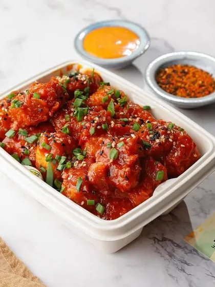 Your food needs to look just as tempting for delivery. This shot of Korean fried chicken is styled specifically for delivery app menus, using clean lighting to make the dish look fresh and appealing right out of the box.