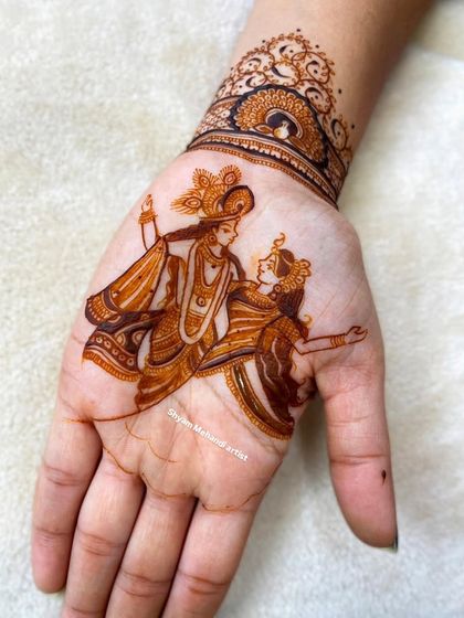 A minimalist yet beautiful portrait of Radha and Krishna on the palm, showing that elegance can be simple.