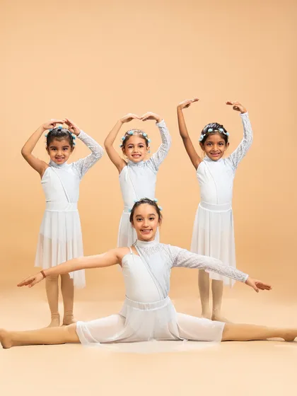 The 'Liquid Soul' group in a joyful and coordinated pose. We teach our young dancers the importance of teamwork and stage presence from an early age.
