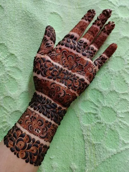 Another beautiful example of a banded design, with each strip featuring a different intricate pattern. This style is both traditional and contemporary.