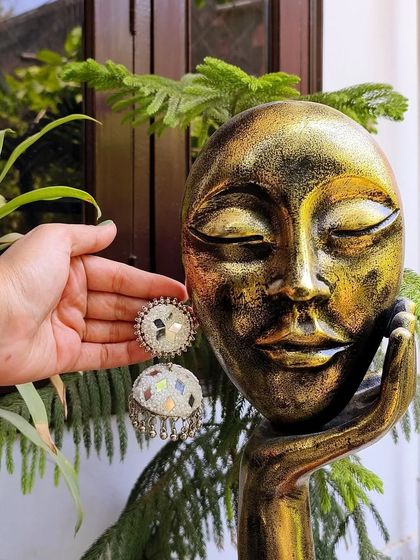 The white version of my oxidised mirror work jhumkas, offering a bright and classic look.