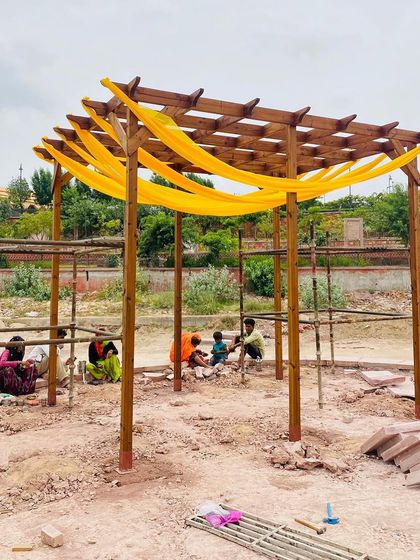 The same pergola structure, now being used for a local event. This shows the versatility of the space it creates, easily decorated for any occasion.