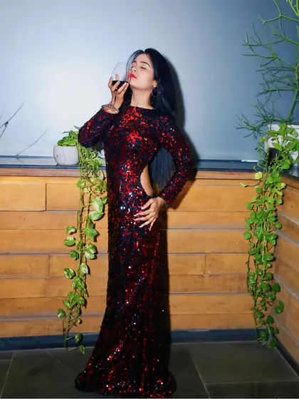 I love creating glamorous party wear. This full-length red sequin gown with a modern side and back cutout is a perfect example. It's designed to be a showstopper for any evening event or cocktail party.