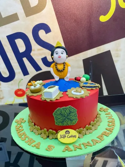 A custom 2kg cake designed for an Annaprasana ceremony, a baby's first rice-eating ritual. The cake features intricate fondant figures and elements representing the sacred occasion.